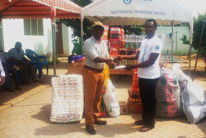  The Managing Director of Radiance Petroleum Limited, Mr Emmanuel Pobee (left), presenting the items to the Director of DAFAREC, Mr Emmanuel Agyepong (right)